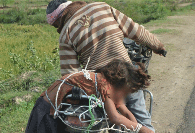 Man ropes daughter to bike for school run