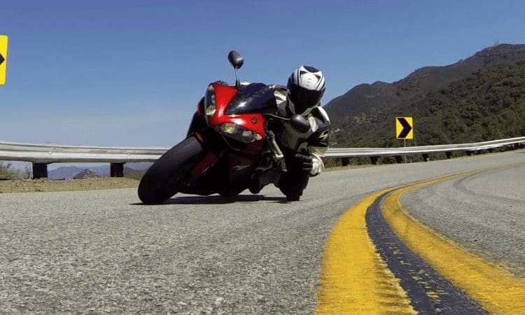 Video: Rider grabs Go Pro mid corner. So cool.