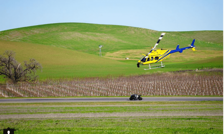 VIDEO: AMAZING onboard footage of helicopter buzzing an R1 on track