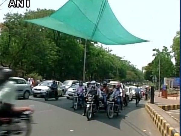 Indian riders get huge sunscreens put up at junctions to save them from the baking sun