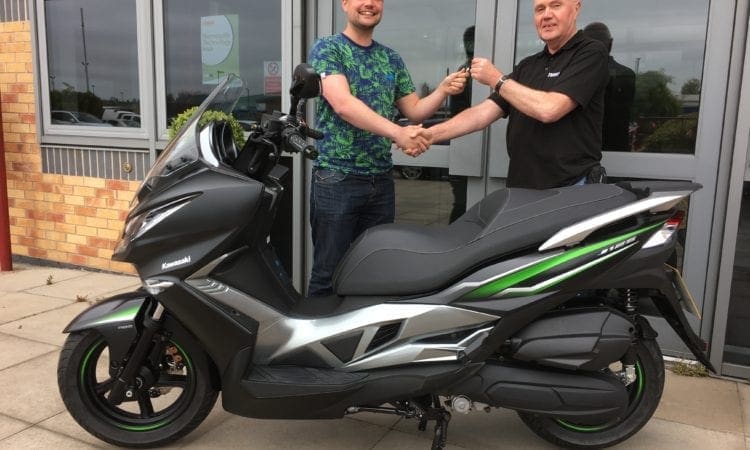 Competition winner picks up his J125 Kawasaki competition prize