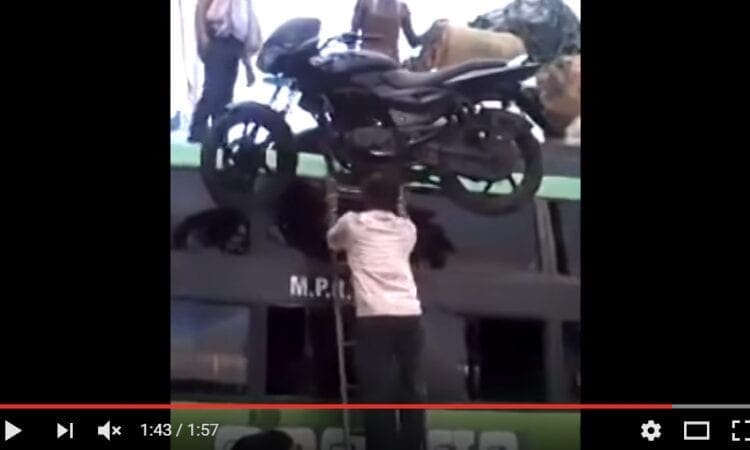 Video: Now THAT’S how you load a motorcycle on top of a bus… sheesh…