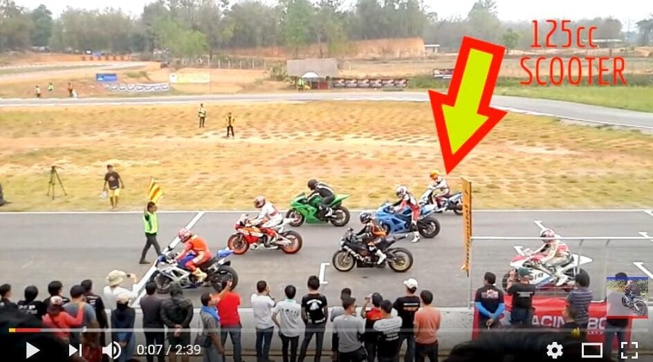 Video: Want to see a 125cc scooter hand it out to 1000cc superbikes on track?