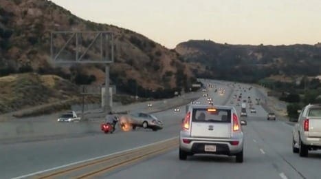 Video: A row between a biker and a car. Then a kick, a car comeback and it gets real crazy, real quick
