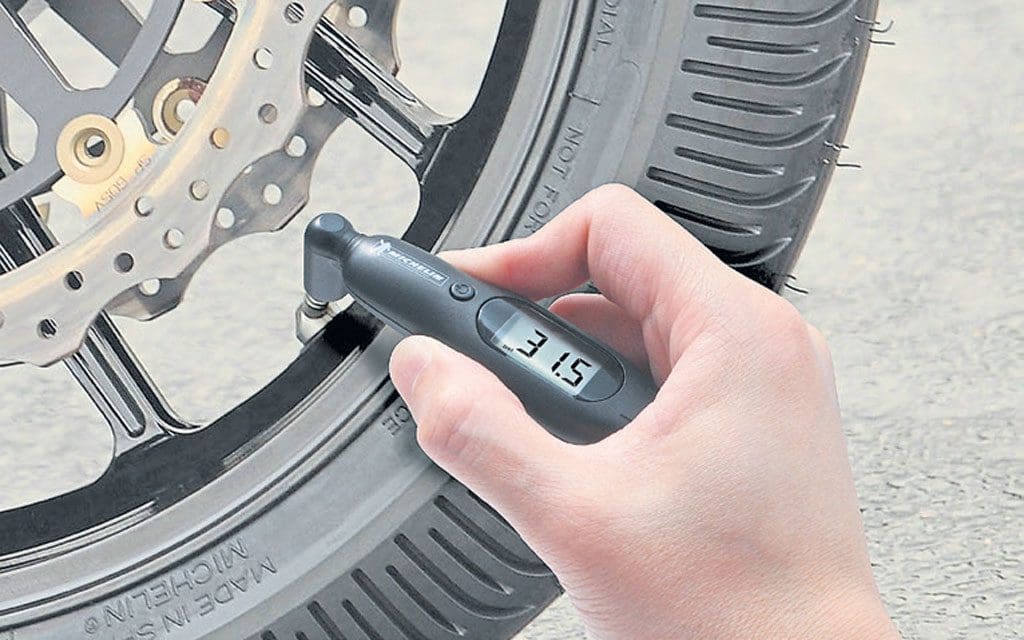 A close up of a tyre pressure checker.