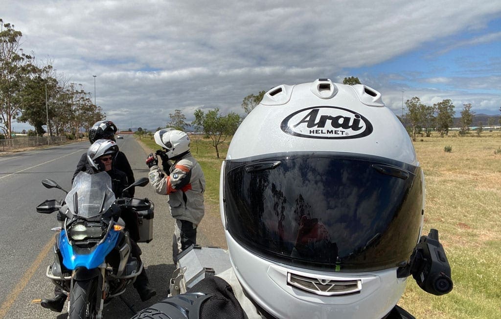 One of the group takes a selfie with their bike helmet on.