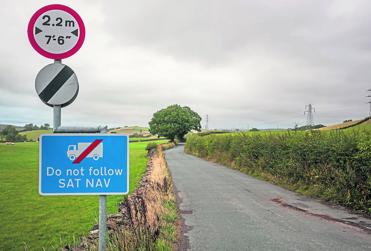 Do not follow SATNAV sign alongside a national speed limit sign in the UK