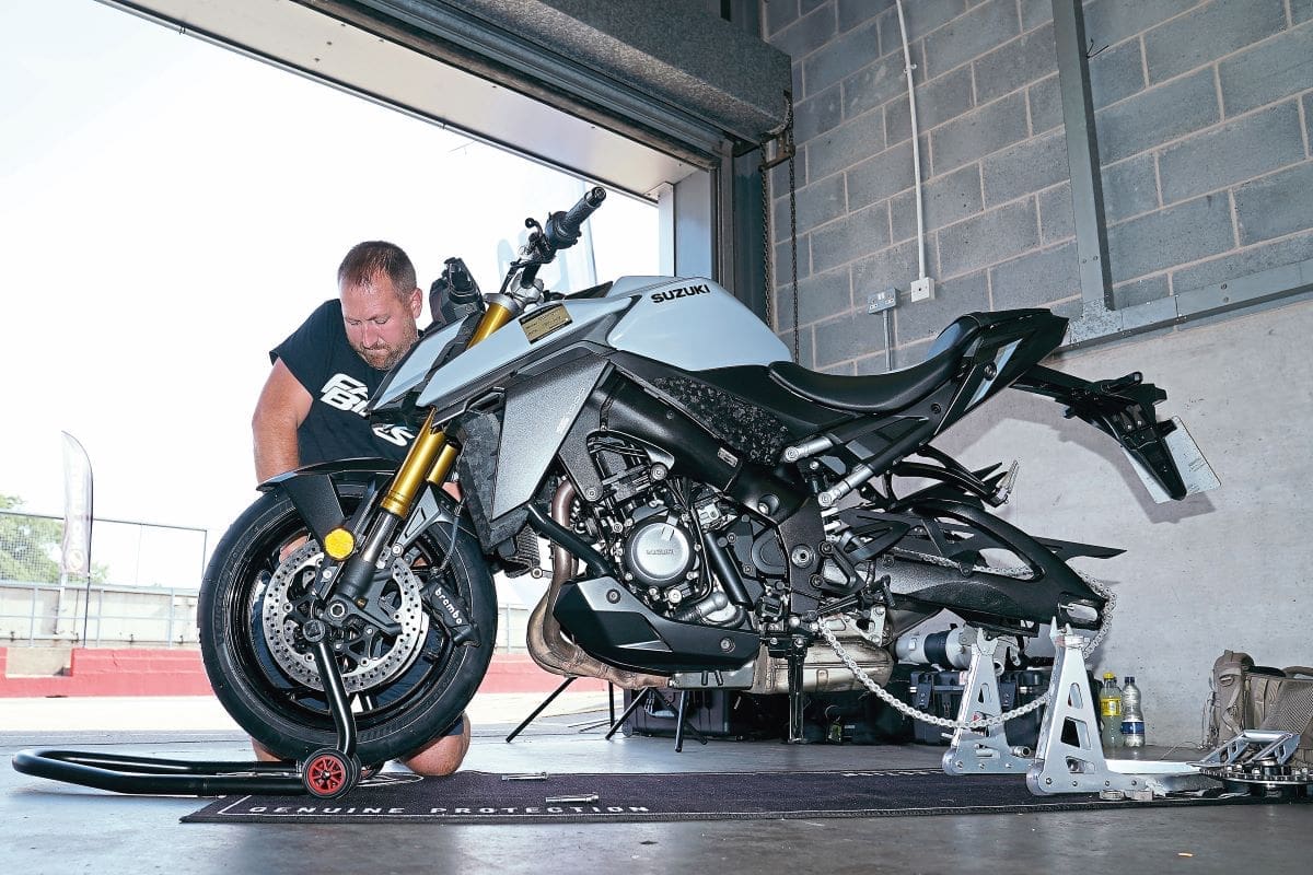 Andy Bell in garage working on the Suzuki GSX-S 1000