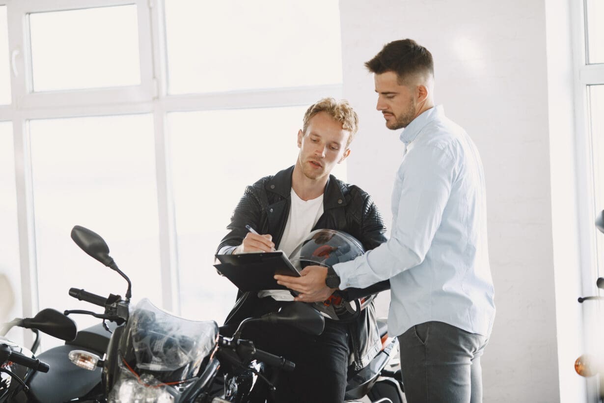 Handsome man choosing a motorcycle to buy