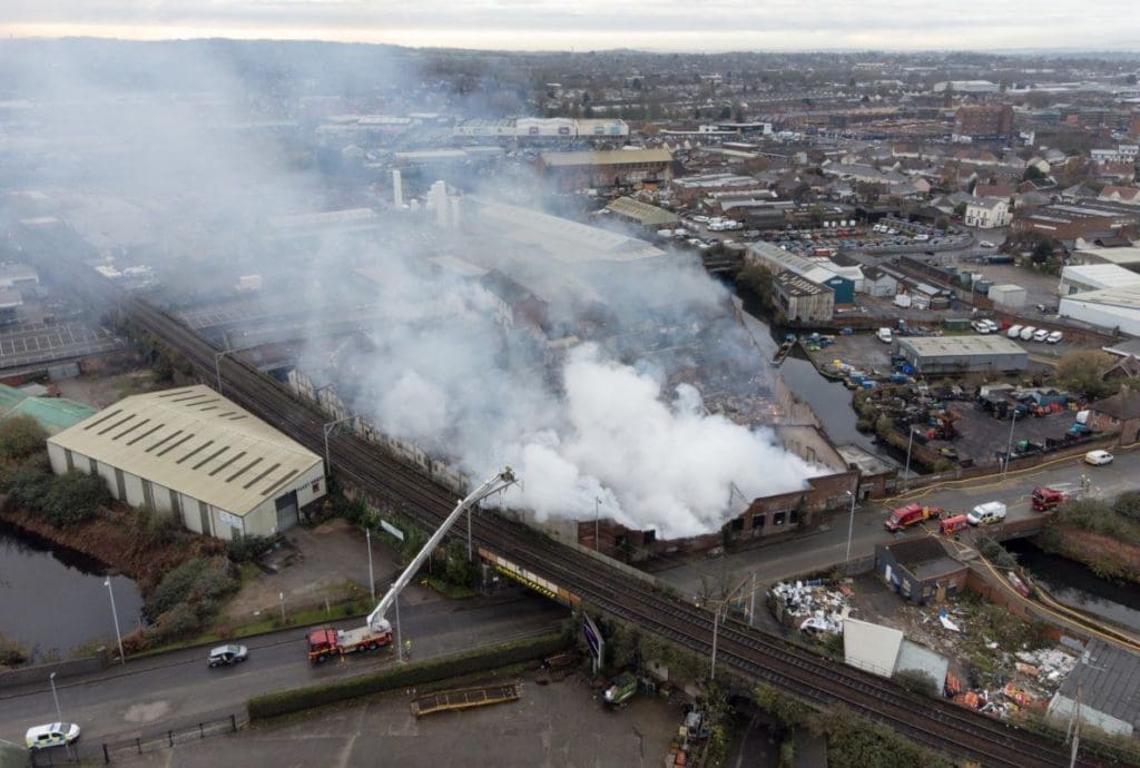 Firefighters tackling a fire in derelict factories near the train station in Wolverhampton.
