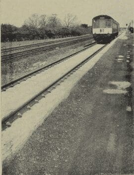 British Railways experimental paved track at Radcliffe-on-Trent: a two-car d.m.u. to Nottingham traverses the “direct laying” track