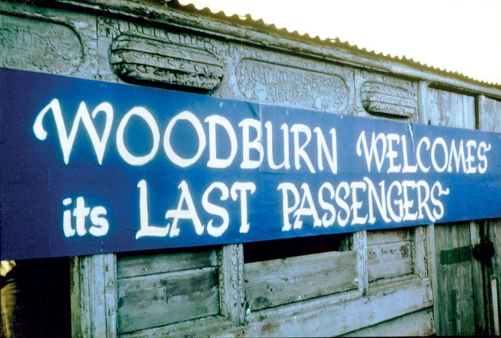 The banner fixed onto the old NER coach on Woodburn station platform.