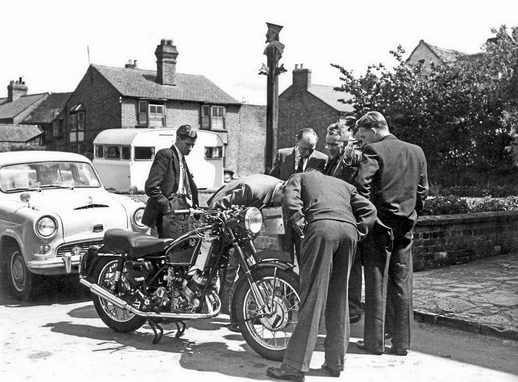 An interested group gather round a 500cc 'flat top' Scott being road testeed by Motor Cycling's Midlands editor Bernal Osborne in 1958