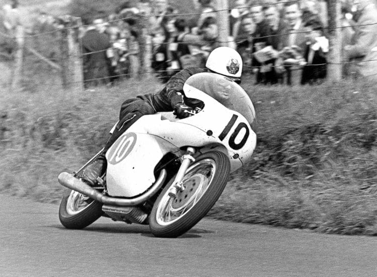 A Tribute to Bob Mac - Always prepared to try something new, McIntyre gallops the factory 350cc Bianchi twin in the 1961 Ulster Grand Prix.