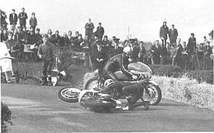 Mike Hailwood on his Honda racing Phil Read