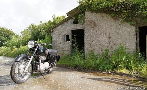 Crumbling antiquity, in need of urgent restoration. And an AJS...