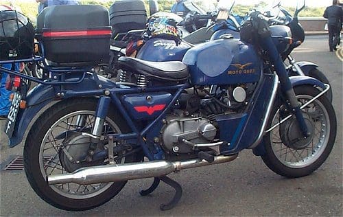 The author's bike. That's a Norton silencer, and a pair of gloves above the cylinder barrel, rather than one of the Munsters...