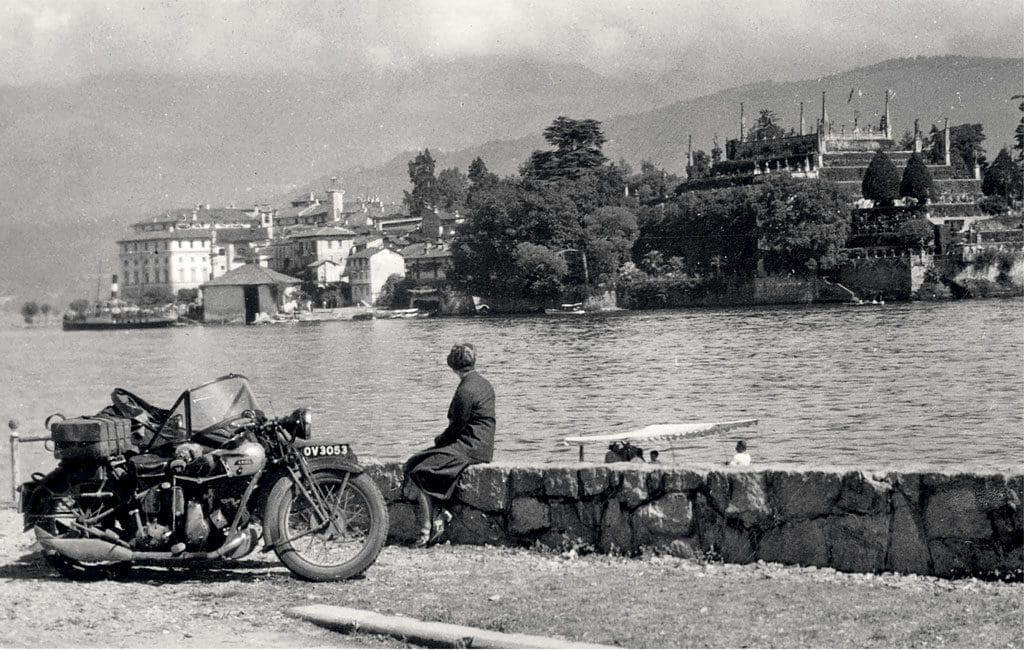Paused by the side of the road, a 1931 550cc Ariel side-valve ‘Sloper’ and sidecar, which has ferried The Motor Cycle’s correspondent Wharfedale (real name Donald Smith, The Motor Cycle’s Northern correspondent) and his wife on a continental trip ‘from Manchester to Maggiore’.