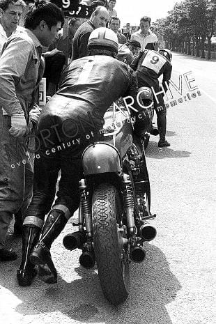 Mike Hailwood pushed the Honda RC181 from the pits in 1967