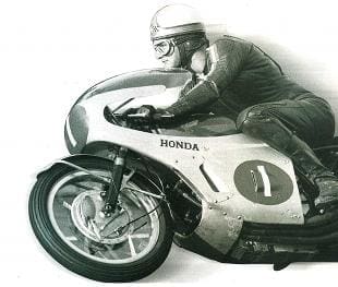 Mike Hailwood on his Honda racing Phil Read