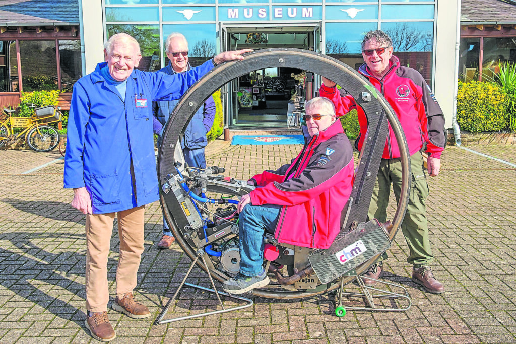 Sammy and his new toy with, on the monowheel Kevin Scott and (right) Mark Foster of the UK Monowheel Team. [Photo by Chris Mabey]