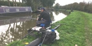 angler on canal bank