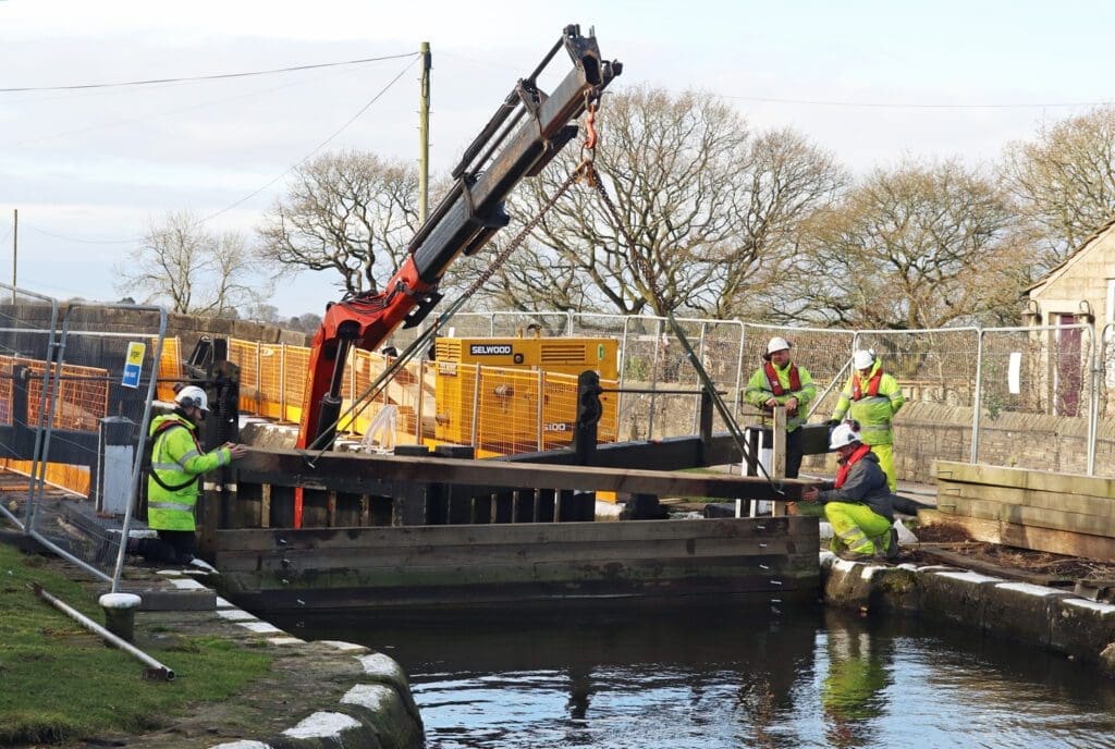 Putting stop planks in at Wheelton top lock.
