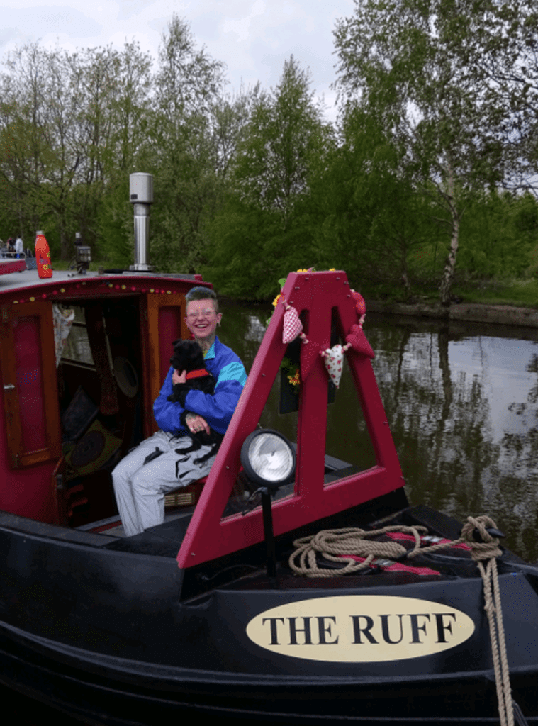 Joanne Embley on board The Ruff with her dog Stanley.