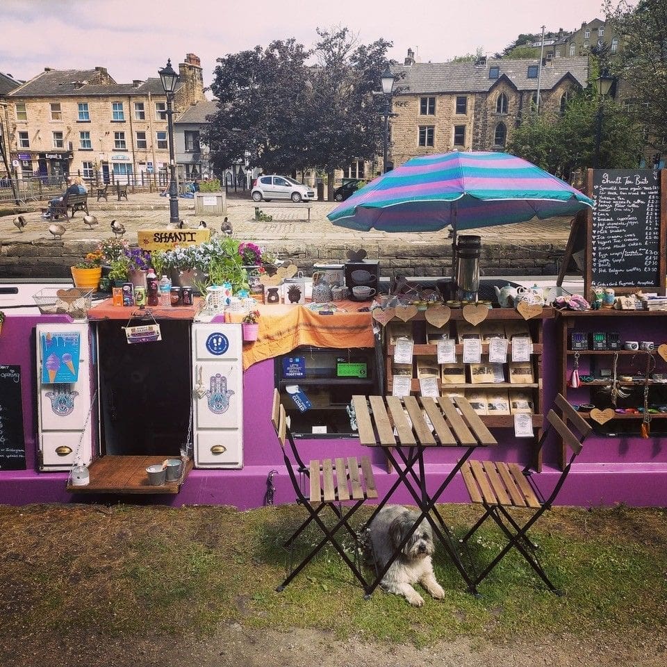 Claire’s dog Marley in front of the Shanti Tea Boat