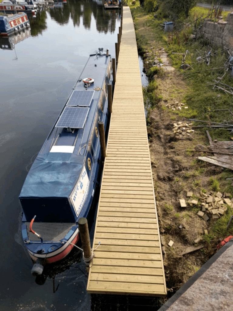 A narrowboat moored alongside the new jetty.