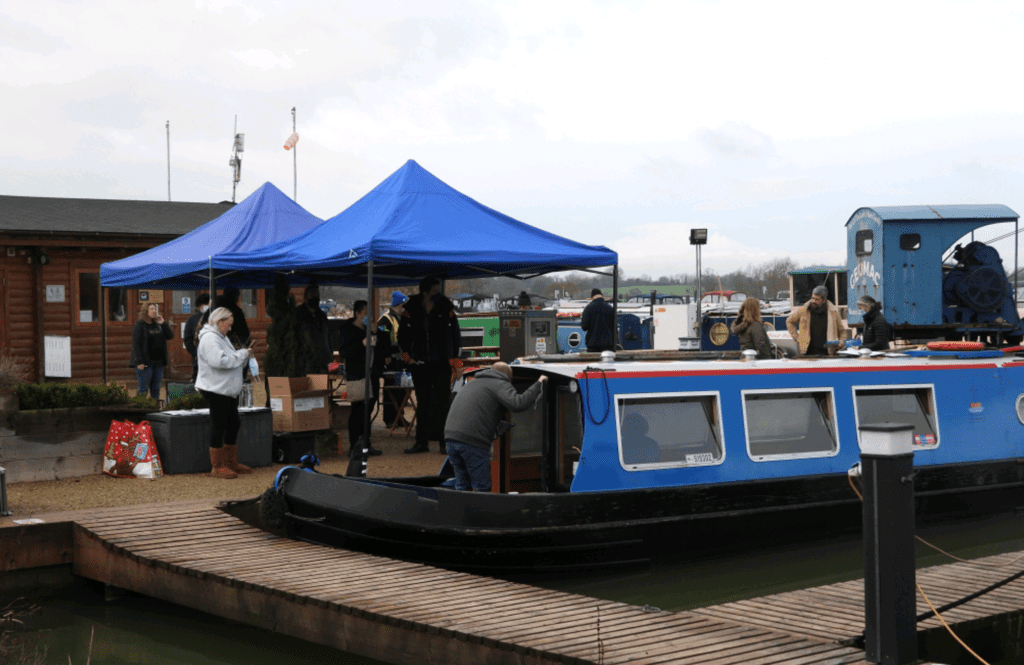 The vaccination ‘booster boat’ and the gazebos at the Caen Hill Marina wharf. 