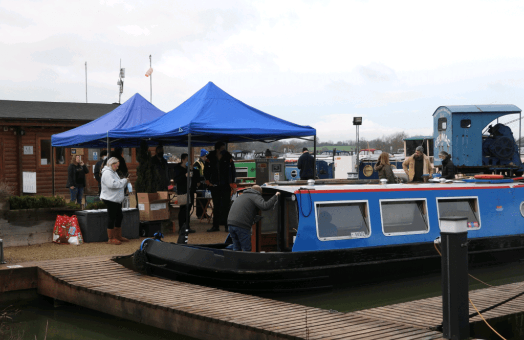 The vaccination ‘booster boat’ and the gazebos at the Caen Hill Marina wharf.