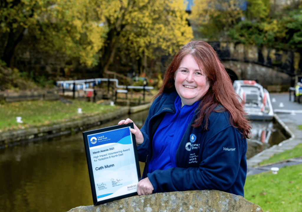 Cath Munn outside the Standedge Tunnel & Visitor Centre with her award certificate.