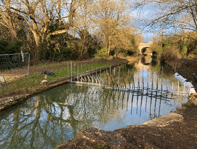 Temporary dams have been installed either side of the bridge.