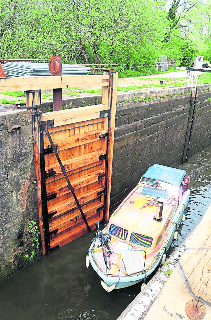 Boat leaves lock 73 passing the new gates 