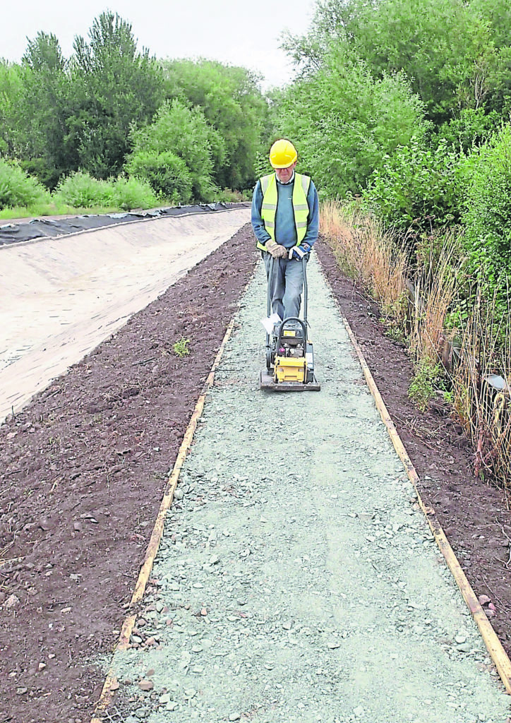 Flattening the towpath.