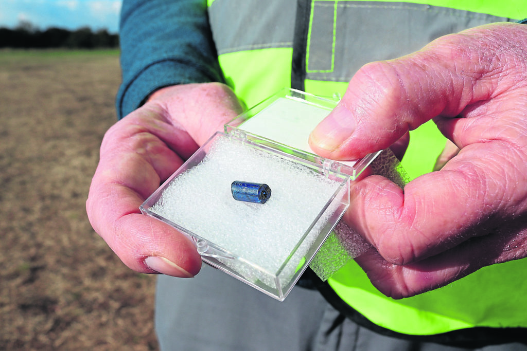 A small blue glass bead found by a volunteer.