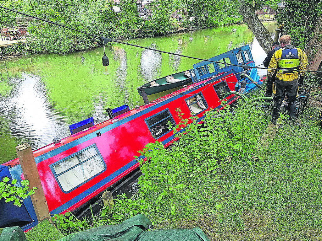 The Wisemans’ narrowboat Tallis which sank after river levels fell rapidly when a weir was opened.