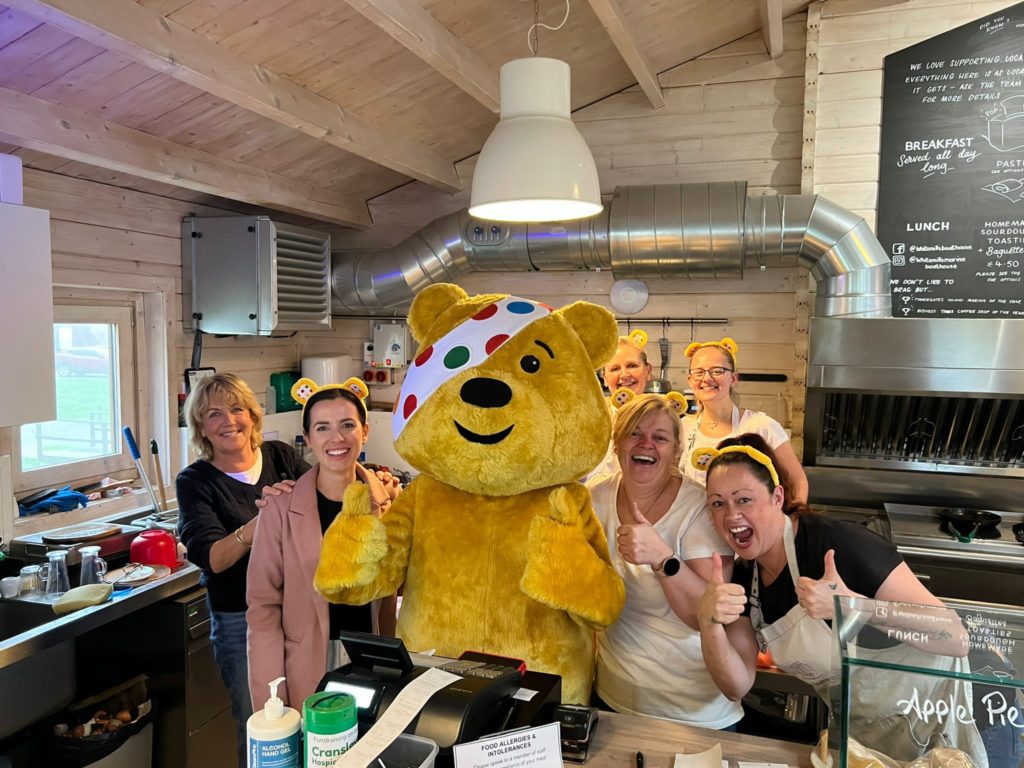 Pudsey and the team in the kitchen at the Boathouse Café