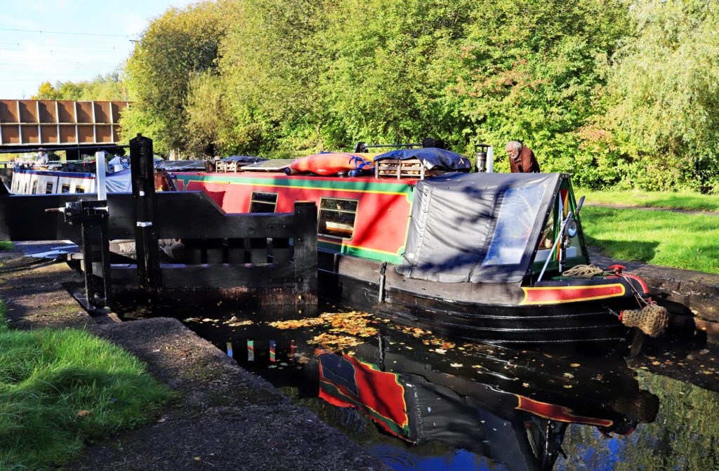 Boat leaving Lock 85 on the Wigan Flight –Photo: COLIN WAREING