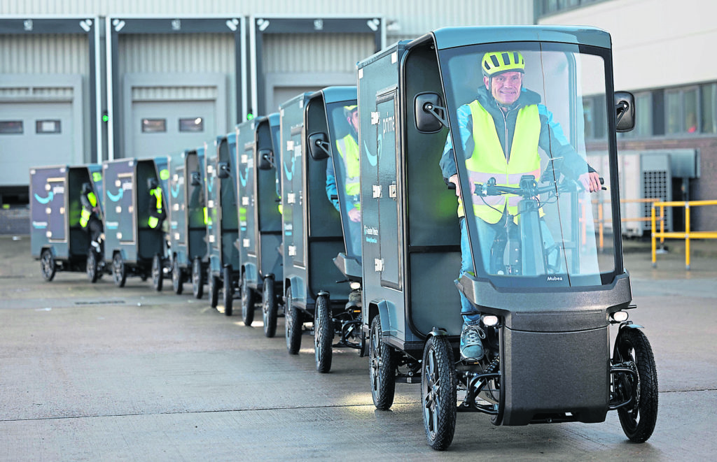 Parcels and light goods complete their ‘last mile’ journey in small, 200kg ‘containers’ masquerading as bicycles! PHOTOS SUPPLIED