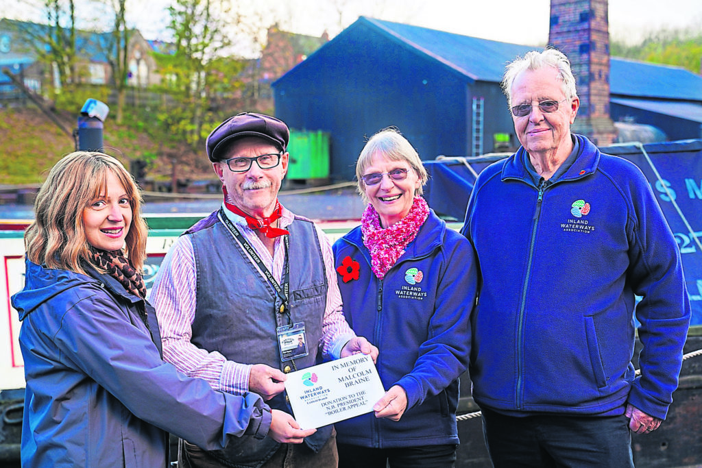 Receiving the cheque are, from left:  Carolyn Sankey, director of development at the Black Country Living Museum and Nick Haynes, chairman of the Friends of President from Sue Gurney, treasurer and Pete Gurney, chairman of IWA Lichfield Branch. PHOTO: IWA