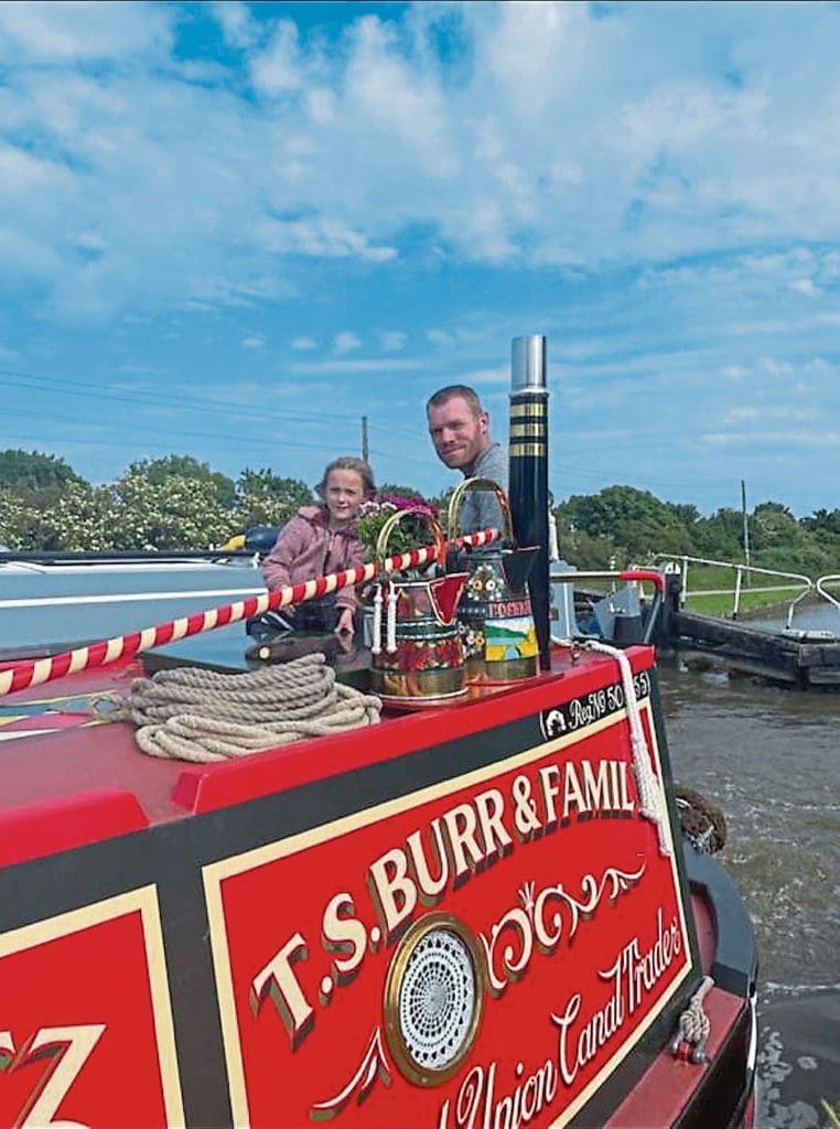 Tim and daughter Grace on board Poshratz.