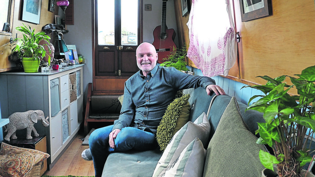 Dave Thompson inside his narrowboat The Isness