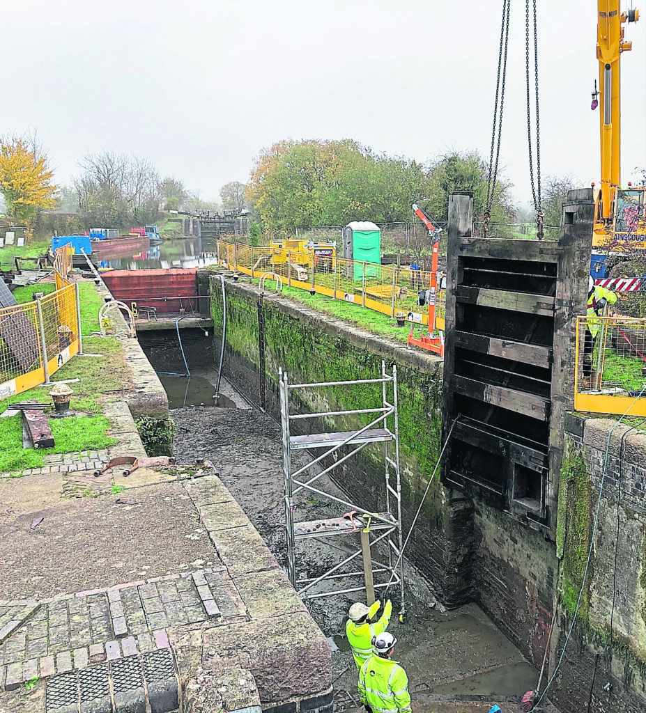 Lowering a new lock gate into place at Lock 29 on the Leicester Line of the Grand Union Canal. PHOTO: CRT