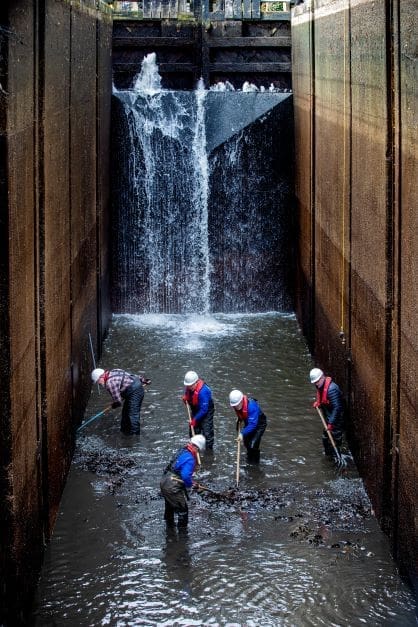 Volunteers removes debris from Tuel Lane Lock,the Uk's deepest lock chamber