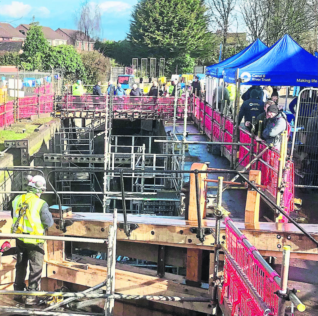 Visitors on the viewing platform above the empty lock.