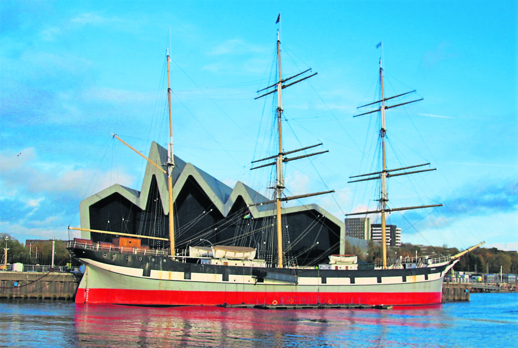 Tall ship Glenlee moored alongside Glasgow’s Riverside Museum. The £1.8 million grant will keep her afloat and open to visitors.