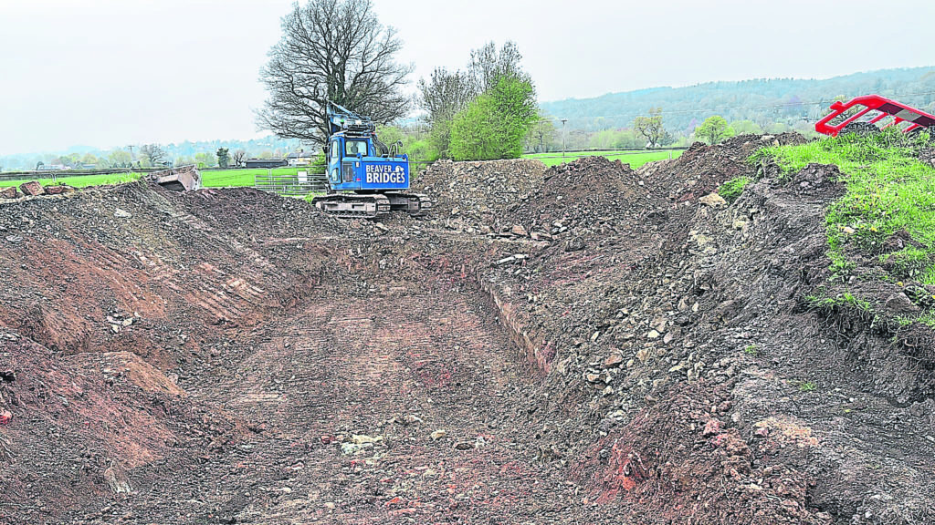 Removing the old road embankment. PHOTOS: BEAVER BRIDGES