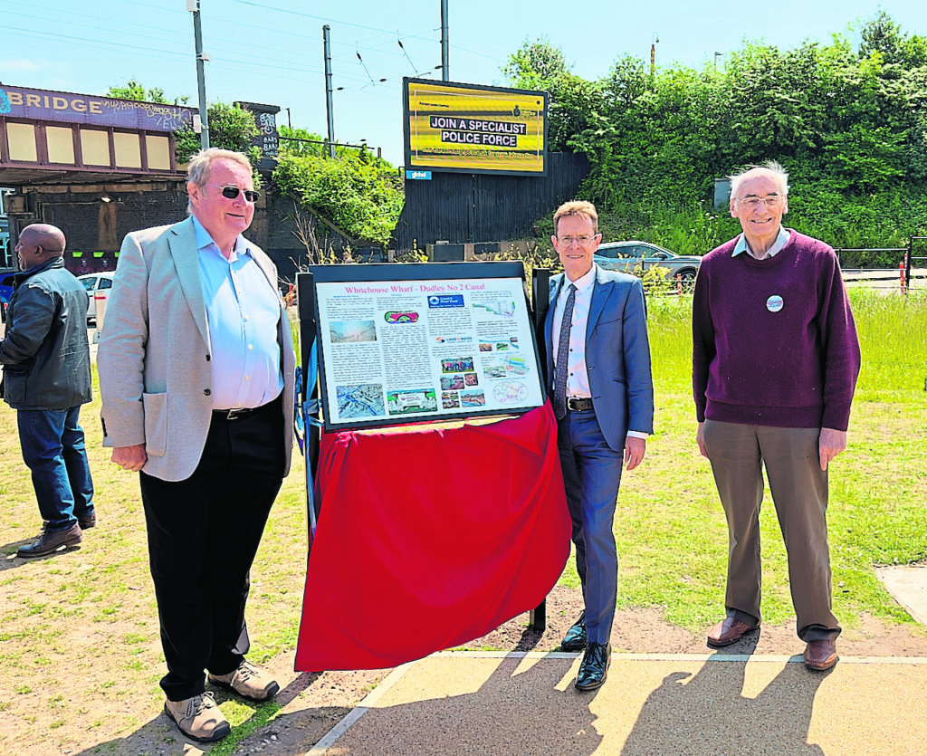 With the new information board are, from left, Andrew Hardy, chairman of the Lapal Canal Trust, Andy Street, West Midlands mayor and Hugh Humphries, trustee of the Lapal Canal Trust.